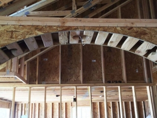 Close-up of interior arch being built Interior ceiling arch in custom built home