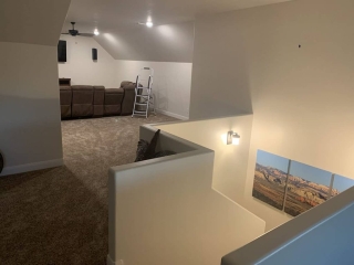 Upstairs living space with pony wall Upstairs pony wall in custom built home