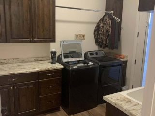 Laundry Room with built in cabinets and sink
